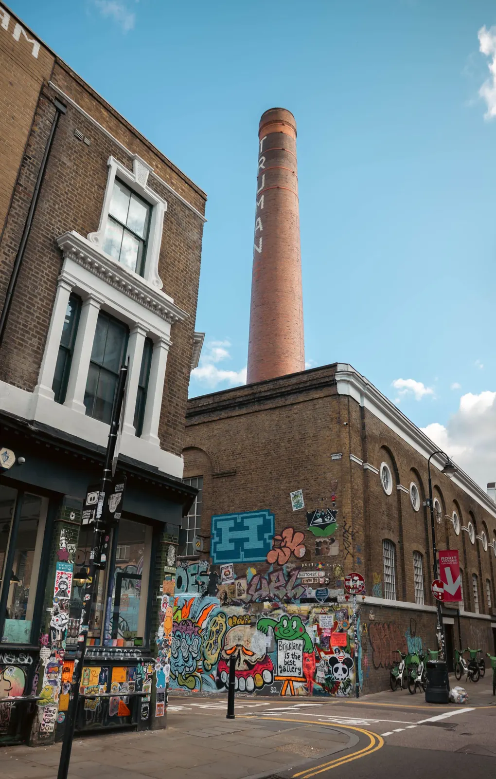 Brick chimney and murals in Shoreditch